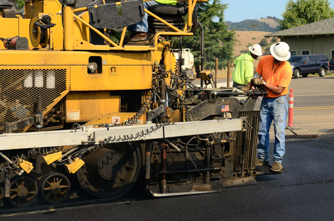 APS Chipsealing and Paving asphalting a road